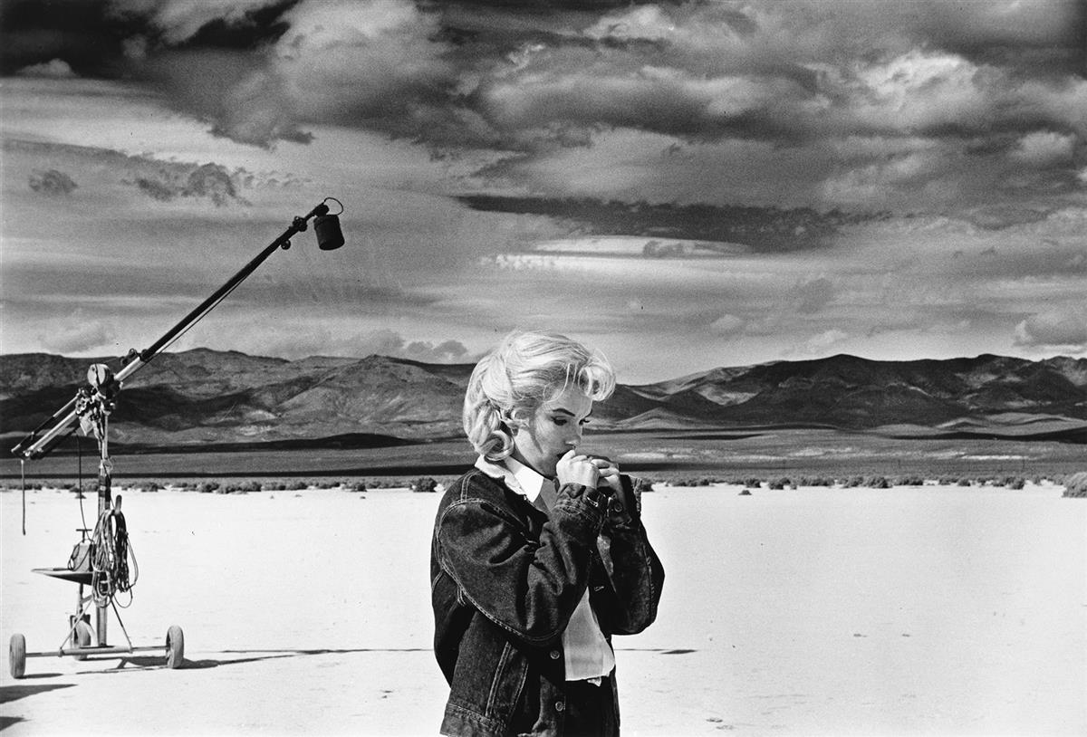 Arnold, Eve (1912-2012) Marilyn Monroe in the Nevada desert rehearsing lines during filming of The Misfits.